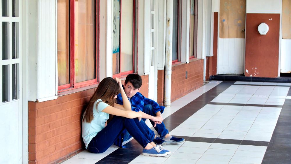 Boy and Girl are Sitting Together